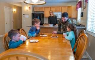 Family at the dining table having a snack