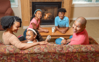 happy family around the fireplace