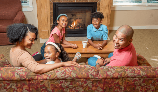 happy family around the fireplace