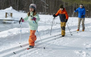 Children cross country skiing